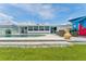 Lush green backyard with a pool, ideal for relaxation and entertainment at 10710 Donbrese Ave, Tampa, FL 33615