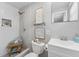 Stylish bathroom featuring a modern shower, vanity, and decorative shelving with decor at 10710 Donbrese Ave, Tampa, FL 33615