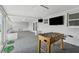 Entertaining bonus room with a foosball table and TV, perfect for recreation at 10710 Donbrese Ave, Tampa, FL 33615