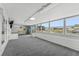 Bright bonus room with multiple windows overlooking the canal; foosball table included at 10710 Donbrese Ave, Tampa, FL 33615