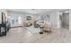 Stylish living room featuring light wood floors and contemporary furnishings at 10710 Donbrese Ave, Tampa, FL 33615
