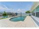 Sparkling pool with large pool deck, waterfront views, and outdoor lounge chairs at 10710 Donbrese Ave, Tampa, FL 33615