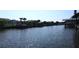 Waterfront view featuring docks, boats, and waterfront homes along the canal on a sunny day at 10710 Donbrese Ave, Tampa, FL 33615