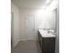 Bathroom with dual sinks, tile floors, and full shower at 10928 Carlton Fields Dr, Riverview, FL 33579