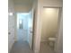 Bathroom with tile flooring, toilet and linen closet at 10928 Carlton Fields Dr, Riverview, FL 33579