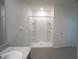 Bathroom featuring shower stall, tile floor and white walls at 10928 Carlton Fields Dr, Riverview, FL 33579