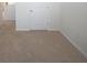 Carpeted floor, white door, and white walls in this bedroom at 10928 Carlton Fields Dr, Riverview, FL 33579