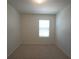 Bright bedroom with carpet floors and a window for natural light at 10928 Carlton Fields Dr, Riverview, FL 33579