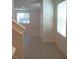Bright entryway with tile flooring and a view into the adjacent living area at 10928 Carlton Fields Dr, Riverview, FL 33579