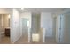 Hallway featuring carpet floors and white walls and trim at 10928 Carlton Fields Dr, Riverview, FL 33579
