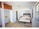 Bright main bedroom features wood floors, a neutral color palette and lots of natural light at 1111 Briarwood Rd, Brandon, FL 33511