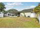 Expansive backyard with a screened-in porch, perfect for outdoor living and entertaining at 11849 Cedarfield Dr, Riverview, FL 33579