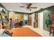 Cozy bedroom with tiled floors and walls painted in a beautiful dark green hue at 11849 Cedarfield Dr, Riverview, FL 33579