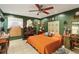 Bedroom featuring tile floors, vintage decor, and an inviting bed at 11849 Cedarfield Dr, Riverview, FL 33579