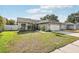 Charming one-story home with a well-manicured lawn and a two-car garage at 11849 Cedarfield Dr, Riverview, FL 33579