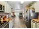 Spacious kitchen showcasing stainless steel appliances, wood countertops, and an open layout at 11849 Cedarfield Dr, Riverview, FL 33579