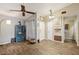 Inviting open-concept living space featuring wood-look tile flooring and modern decor at 11849 Cedarfield Dr, Riverview, FL 33579