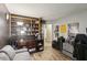 Cozy living room features built-in shelving, wood-look flooring, and neutral paint, offering a relaxing and inviting space at 11849 Cedarfield Dr, Riverview, FL 33579