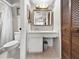 Well-lit bathroom with a vanity, mirror, and ample storage at 12125 71St Way, Largo, FL 33773