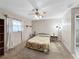 Comfortable bedroom with ceiling fan, neutral walls and ample natural light at 12125 71St Way, Largo, FL 33773