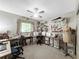Spacious craft room with a ceiling fan, plenty of storage, multiple tables and sewing machines at 12125 71St Way, Largo, FL 33773