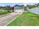 Charming single-Gathering home with a two-car garage and well-manicured lawn at 12125 71St Way, Largo, FL 33773