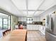 Bright kitchen with a stainless steel refrigerator, tile floors, and access to the backyard at 12125 71St Way, Largo, FL 33773