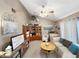 Comfortable living room with lots of decor, featuring a ceiling fan and neutral walls at 12125 71St Way, Largo, FL 33773