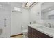 Bathroom featuring a white vanity with dark cabinets and a shower at 1221 Candlelight Blvd, Brooksville, FL 34601