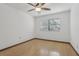 Bedroom with ceiling fan, wood floors and window with blinds at 1221 Candlelight Blvd, Brooksville, FL 34601