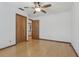 Bedroom with wood floors, ceiling fan and closet at 1221 Candlelight Blvd, Brooksville, FL 34601