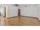 Spacious bedroom with hardwood floors, a ceiling fan, and an en-suite bathroom for added convenience at 1221 Candlelight Blvd, Brooksville, FL 34601