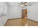 Bedroom with ceiling fan, wood floors and window with blinds at 1221 Candlelight Blvd, Brooksville, FL 34601