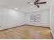 Bedroom with ceiling fan, wood floors and window with blinds at 1221 Candlelight Blvd, Brooksville, FL 34601