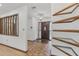 Charming foyer with decorative shelving, tile flooring, and a wooden front door at 1221 Candlelight Blvd, Brooksville, FL 34601