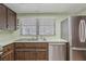 Kitchen area featuring stainless steel appliances, and natural light at 1221 Candlelight Blvd, Brooksville, FL 34601