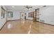 Large living room with hardwood floors, built-in shelving, and a view into the dining area at 1221 Candlelight Blvd, Brooksville, FL 34601