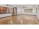 Bright living room with hardwood floors, built-in shelving, and ample natural light at 1221 Candlelight Blvd, Brooksville, FL 34601