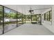 Enclosed patio with ceiling fans, offering an outdoor space to entertain or relax away from the elements at 1221 Candlelight Blvd, Brooksville, FL 34601