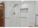 Shower with rainfall shower head, frameless glass and mosaic accent tile at 1221 Candlelight Blvd, Brooksville, FL 34601