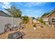 Outdoor backyard patio area with brick pavers, seating, and lush landscaping at 1410 Monte Lake Dr, Valrico, FL 33596