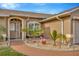 Welcoming front entrance with decorative landscaping and a brick walkway at 1410 Monte Lake Dr, Valrico, FL 33596