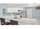 A kitchen with white countertops, stainless appliances, and breakfast bar seating at 1410 Monte Lake Dr, Valrico, FL 33596