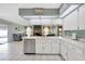 A kitchen featuring white countertops, a stainless dishwasher, and an open floor plan at 1410 Monte Lake Dr, Valrico, FL 33596