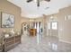 Open living area with tile floors, wet bar, and view of the front entry at 1410 Monte Lake Dr, Valrico, FL 33596