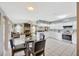 A dining area with an open view of the living room and kitchen at 1410 Monte Lake Dr, Valrico, FL 33596