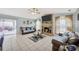Cozy living room features a brick fireplace, tile floors, and access to the lanai at 1410 Monte Lake Dr, Valrico, FL 33596