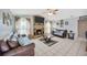 This living room offers a brick fireplace, ceiling fan, and two couches facing each other at 1410 Monte Lake Dr, Valrico, FL 33596