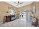 Comfortable living area with tile flooring and sliding glass doors to the pool area at 1410 Monte Lake Dr, Valrico, FL 33596