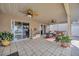Covered patio furnished with tiled floors and ceiling fans, leading to a sparkling pool for enjoyable outdoor gatherings at 1410 Monte Lake Dr, Valrico, FL 33596